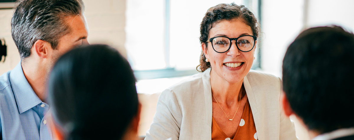 image of smiling people in a meeting